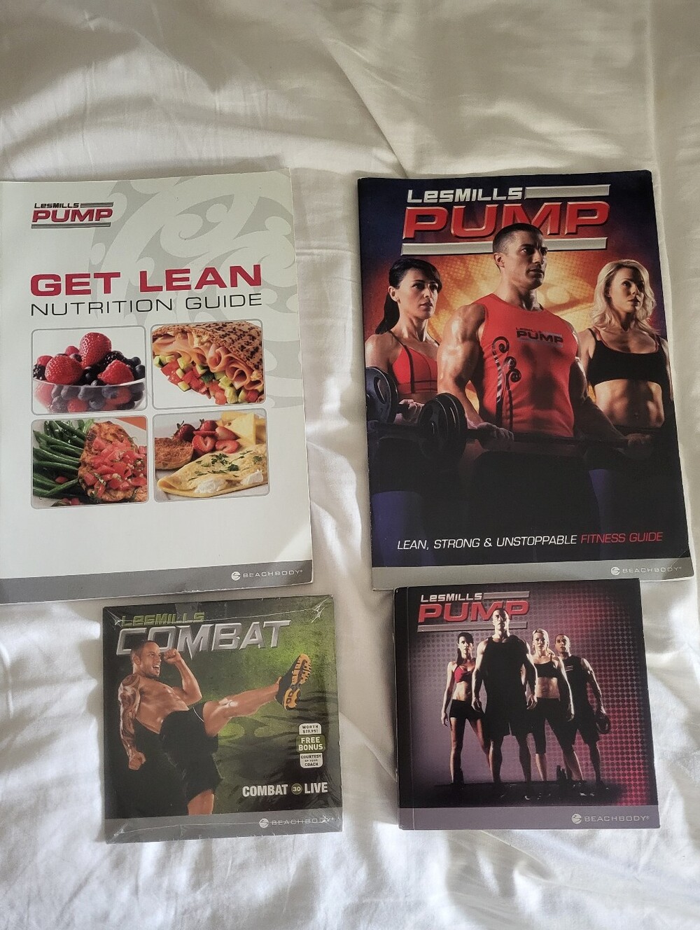 Beachbody Combat and Pump Workout DVDs with Nutrition Guide - Gently Used
